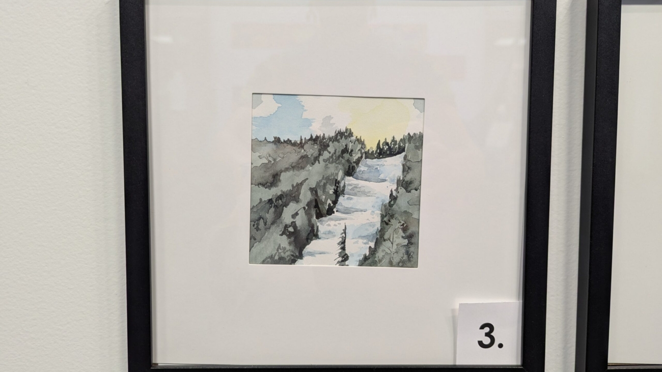 5x5 watercolor painting of a ski slope in Maine in a 10x10 frame.
