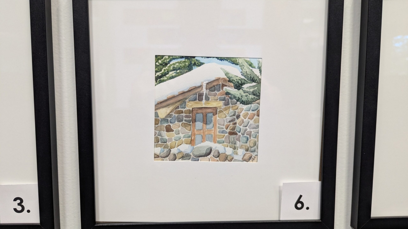 A 5x5 Watercolor of a stone massage hut at Strawberry Park in Steamboat, CO. It is in a 10x10 frame.