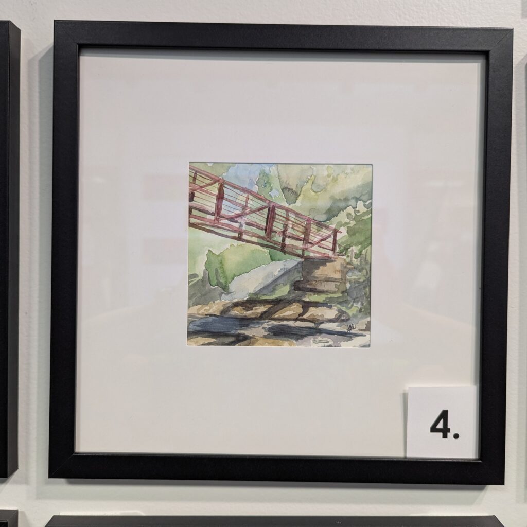 5x5 watercolor painting of a red bridge in Manchester, NH in a 10x10 frame.