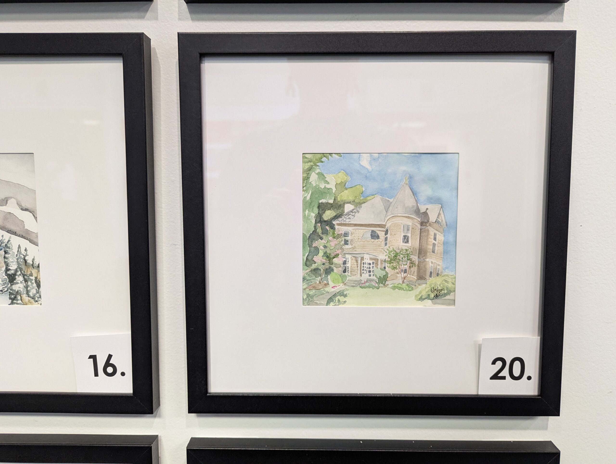 5x5 watercolor painting of a Victorian home with an acorn tower in a 10x10 frame.