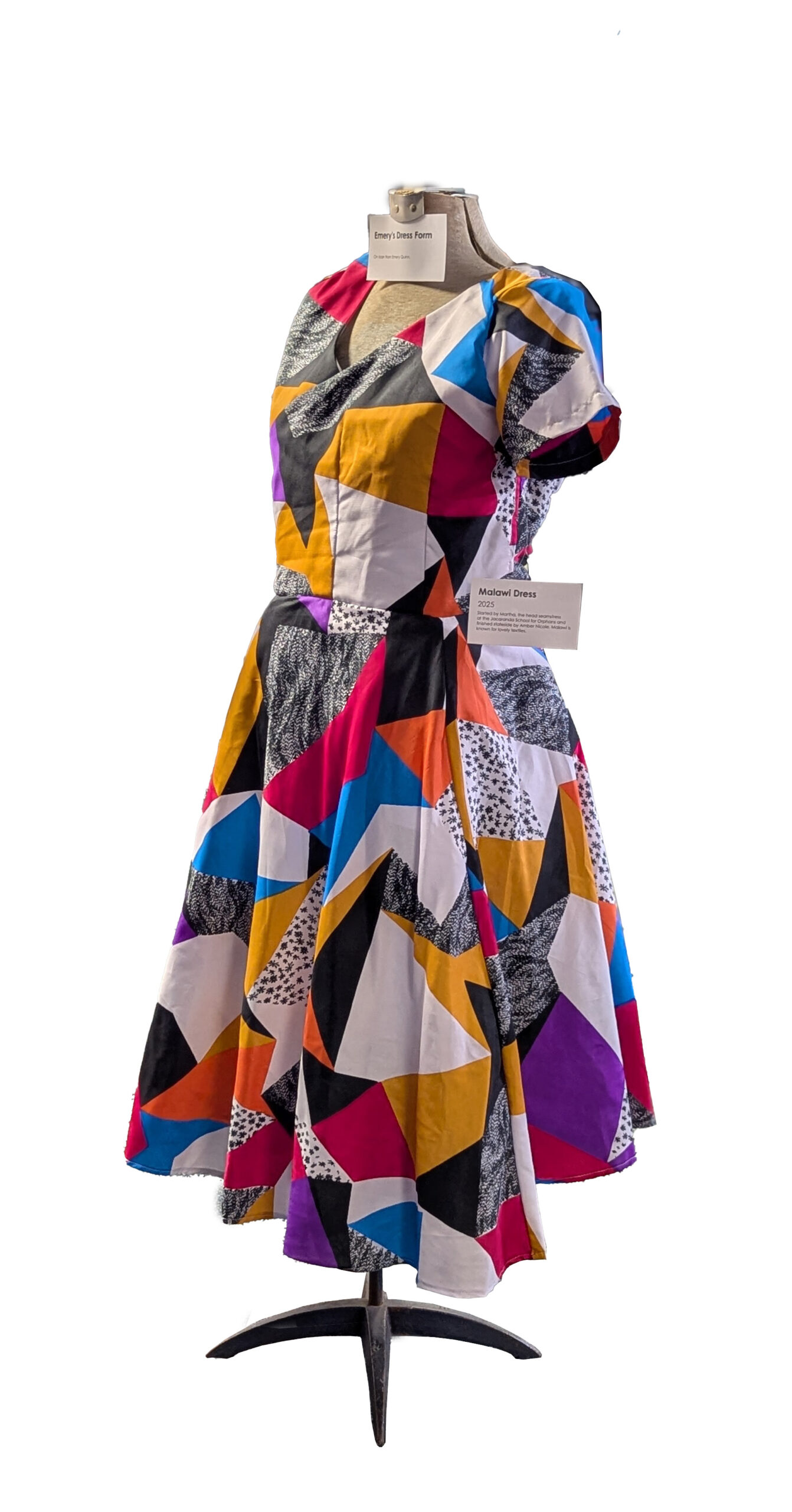 A loudly colored geometrically patterned wrap dress.